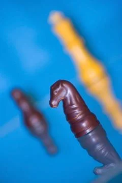 Chess Pieces on a Blue Background Stock Photos