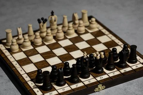 Chess pieces on board in incorrect initial position. king is not in his cell Stock Photos