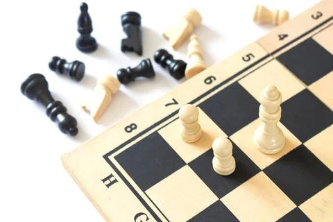 Chess pieces on chess board game top view Stock Photos