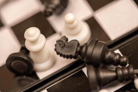 Chess pieces on a chessboard. Close-up, selective focus Stock Photos