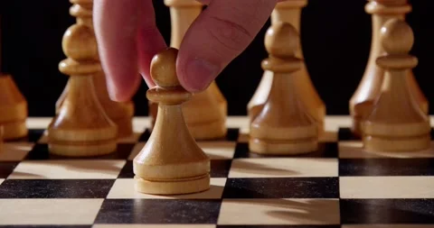 Chess pieces on a chessboard. The first move. Wooden chess Video stock 238776231
