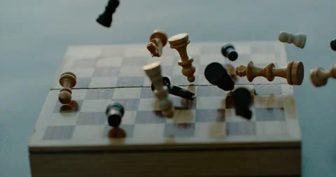 Chess Pieces fall onto chess board in super slow motion Stock-Footage 247092514