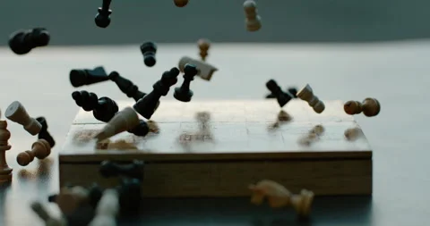 Chess Pieces fall onto chess board in Super Slow Motion Video stock 247092555