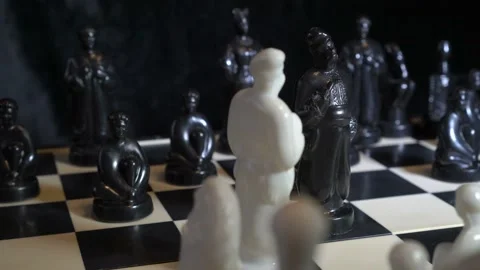 Chess pieces in the form of Slavic Cossacks stand on a chessboard Video stock 88286827
