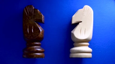 Chess pieces knight on blue background Stock Footage 250438047