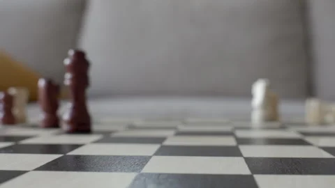 Chess pieces knocked down on board during game Stock Footage 333490447