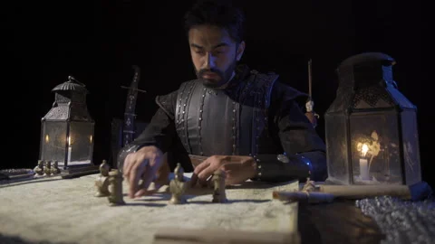 Chess pieces on the map in ancient times. War preparation in historical times.  Stock Footage 199552318