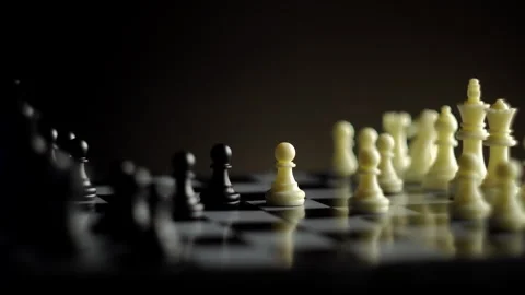 Chess pieces move on a chessboard on a dark background Stock Footage 263344481