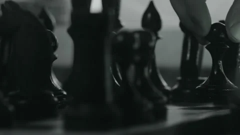 Chess pieces placed on the chessboard. Black and white video of chess game Stock Footage 186443998