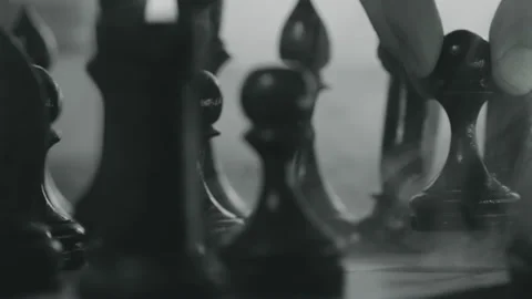 Chess pieces placed on the chessboard. Black and white video of chess game Stock Footage 201569787
