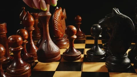 Chess pieces placed on the chessboard. Black and white video of chess game Stock Footage 241044645