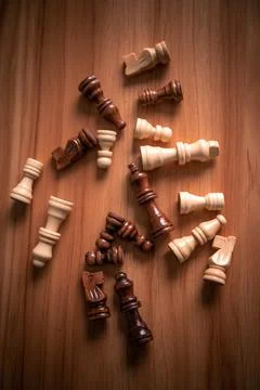Chess pieces with scissors on a table Stock Photos