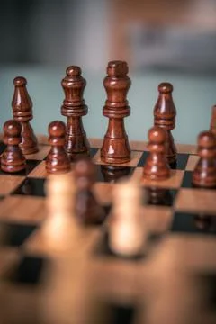 Chess pieces set up ready to play chess game on a wooden board strategy game  Stock Photos