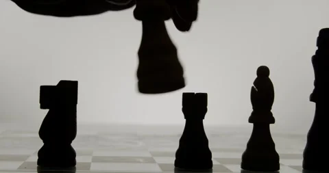 Chess Pieces Silhouette during a chess game Stock Footage 243470876