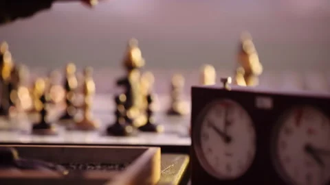 A chess player moves chess pieces on the game board. Stock Footage 167905268
