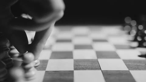 Chess Player moves their pawn back and forth in indecision 스톡 동영상 262007977
