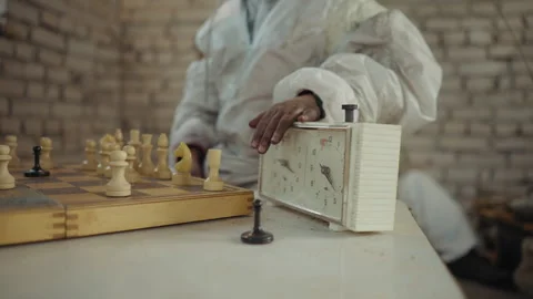 Chess Player Taps Clock During Game in Cold Room 動画素材 327019836