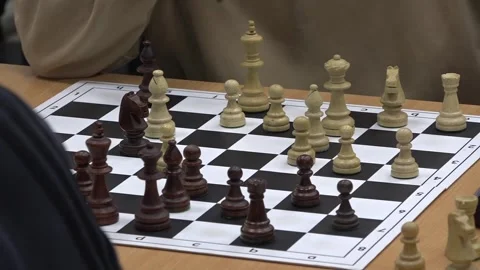 Chess players playing a game, considering their next move.  Close-Up Shot Stock-Footage 332806620