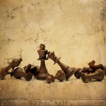 Chess set on a textured beige background Stock Photos