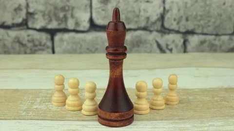 Chess small pawns and big king Stock Footage 78531644