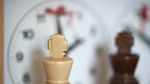 Chess, white and black king face each other, chess clock ticking (with slider) Stock Footage 110950412