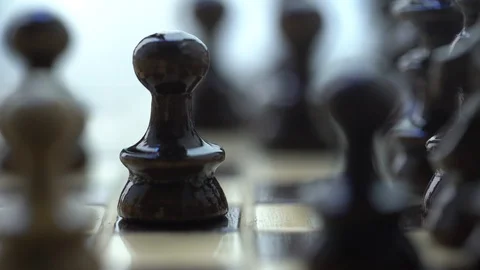 Chess. white horse eats black pawn Stock Footage 127051833