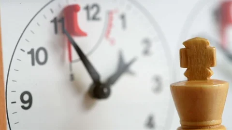 Chess, white king in front of a chess clock, which is ticking (with slider) Stock Footage 110967464