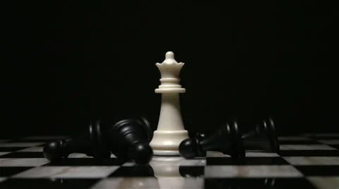 Chess White Queen Surrounded by Fallen Black Pawns 3 Stock Footage 61405961