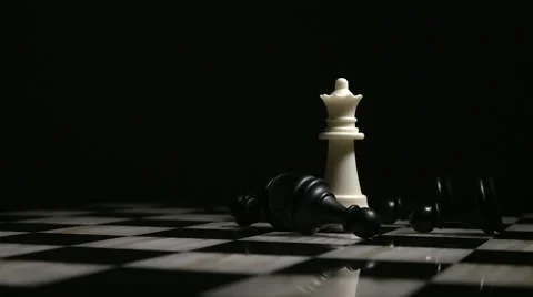 Chess White Queen Surrounded by Fallen Black Pawns 2 Stock Footage 61406494