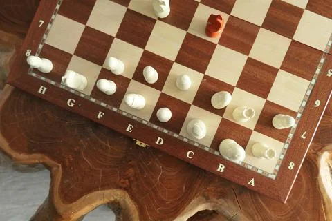 Chess on wood table with box Stock Photos
