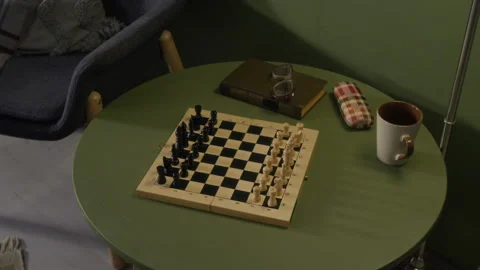 Chessboard with Book and Glasses on Table for Senior Leisure Stock Footage 336939834