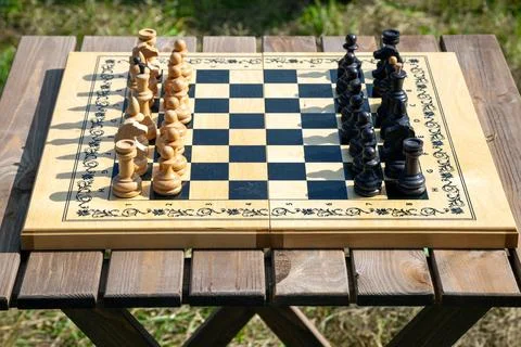 Chessboard with Chess Pieces on Table Stock Photos