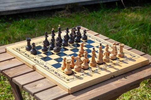Chessboard with Chess Pieces on Table Photos