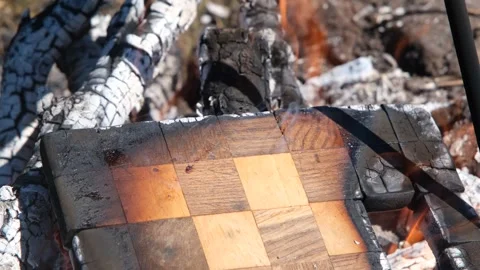 Chessboard on fire. The chessboard is burning in the fire. Burning chessboard. Stock Footage 278867949