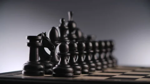 Chessboard with lines of black wooden chess figures Stock Footage 166399090