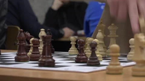 A chessboard with an ongoing game, showing strategic moves and careful planning. Stock-Footage 332807492