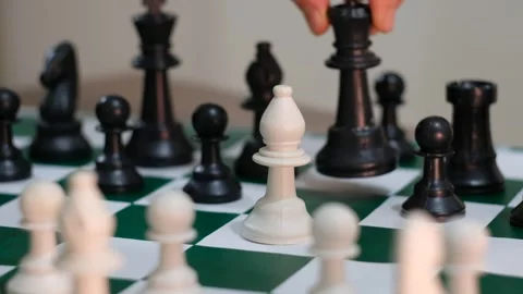 Chessboard piece being moved on the table Stock Footage 241704438