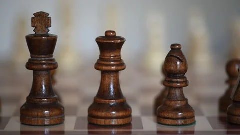 Chessboard, View on black figures on chessboard, start setting up (with slider) Stock Footage 110943112
