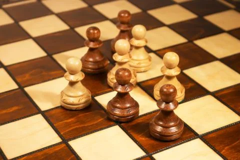 Chessmen on the chessboard Stock Photos