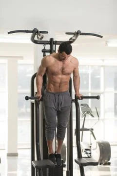 Chest And Triceps Exercise on Parallel Bars Stock Photos