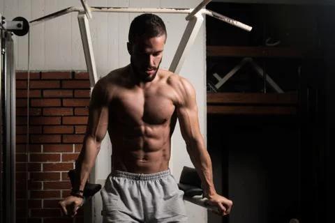 Chest And Triceps Exercise on Parallel Bars Stock Photos