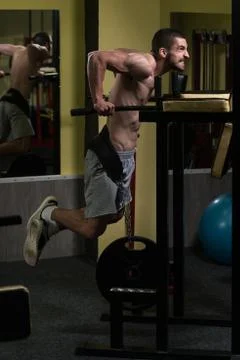 Chest And Triceps Exercise on Parallel Bars Stock Photos