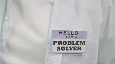 Chest closeup showing problem solver badge in shirt pocket 스톡 동영상 329325766