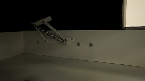 A chest of drawers of an angular sofa opens with the help modern mechanisms Video stock 127620833