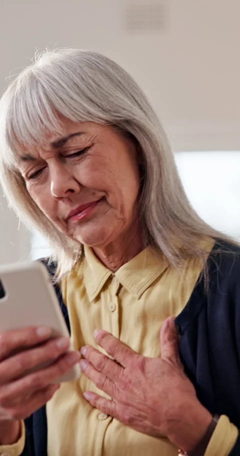 Chest pain, mobile or old woman in home for telehealth, research symptoms or 動画素材 338426973
