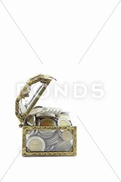 Chest with wealth coins inside side perspective Stock Photos