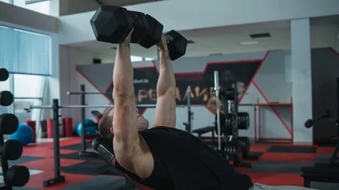 Chest workout with dumbbells. Loop Stock Footage 82355941