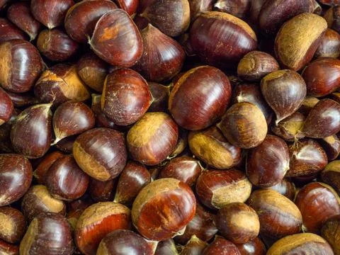 Chestnut nuts. Background of nuts without shells. Snack on the table. Unpeele Stock Photos