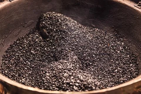 Chestnut roaster, roasting machine made from large wok or built pot and autom Stock Photos