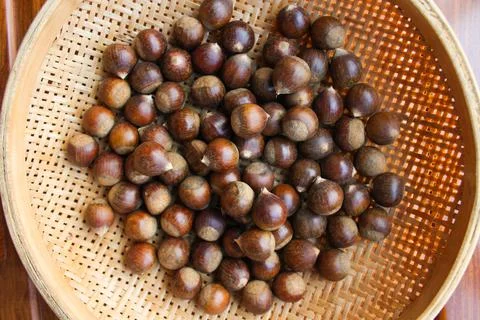 Chestnuts in a basket. Stock Photos